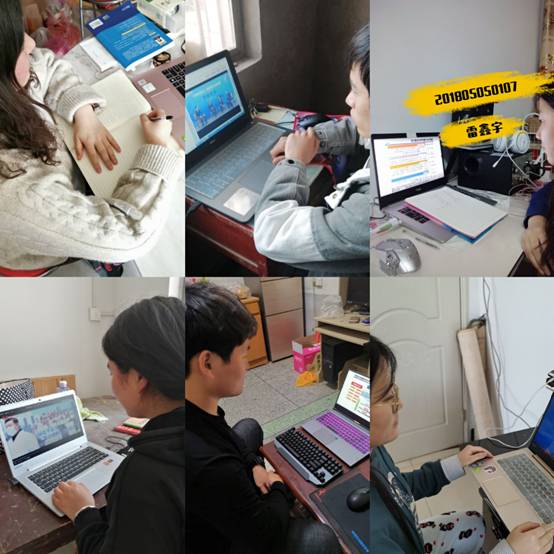 一群人看着桌子上的电脑描述已自动生成